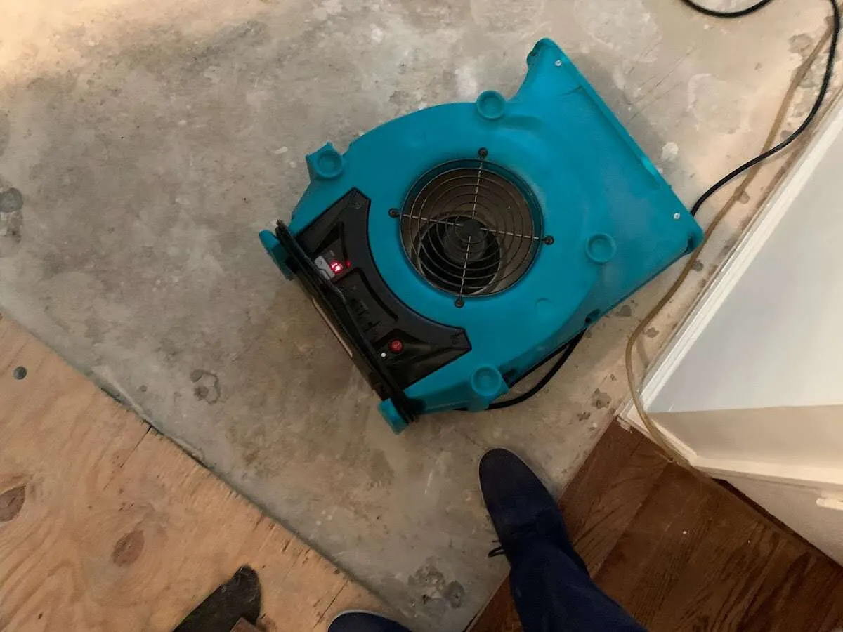 Air mover drying subfloor during Leak Detection & Repair in Laguna Hills
